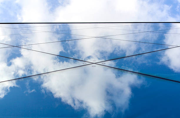 istock reflexions of clouds and  sky in modern building facade 478578939
