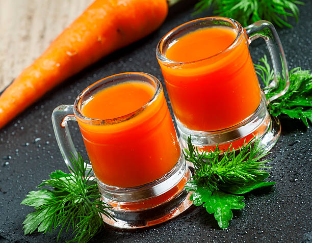 istock Fresh carrot juice  in old-fashioned glass mug 478579196