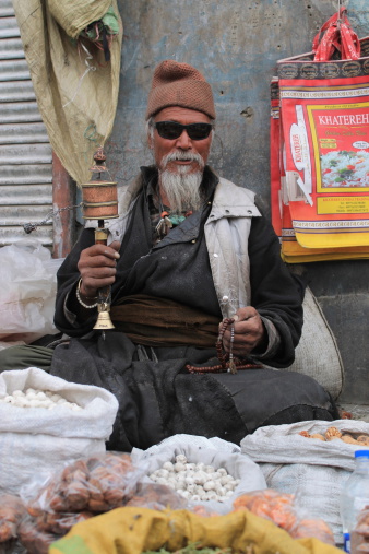 Leh,India-August 15,2013- Senior marketer selling traditional tibetian medicine. Culture and history of Ladakh are closely related to that of Tibet.