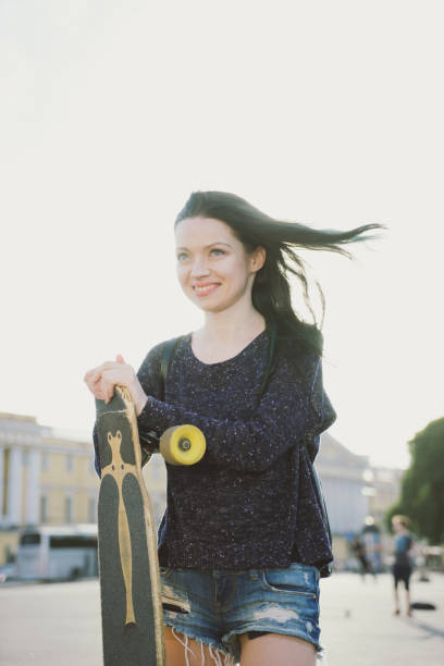 istock Attractive Young Woman With Longboard 478581580