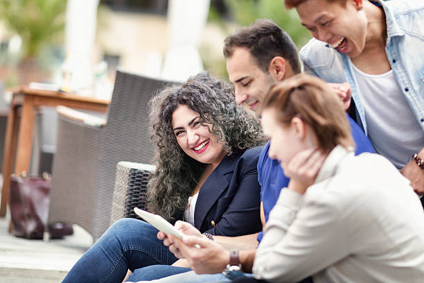 istock young adults friendhip laughing having fun digital tablet 478582000