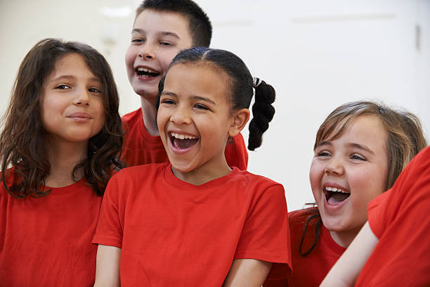istock Group Of Children Enjoying Drama Class Together 478582404