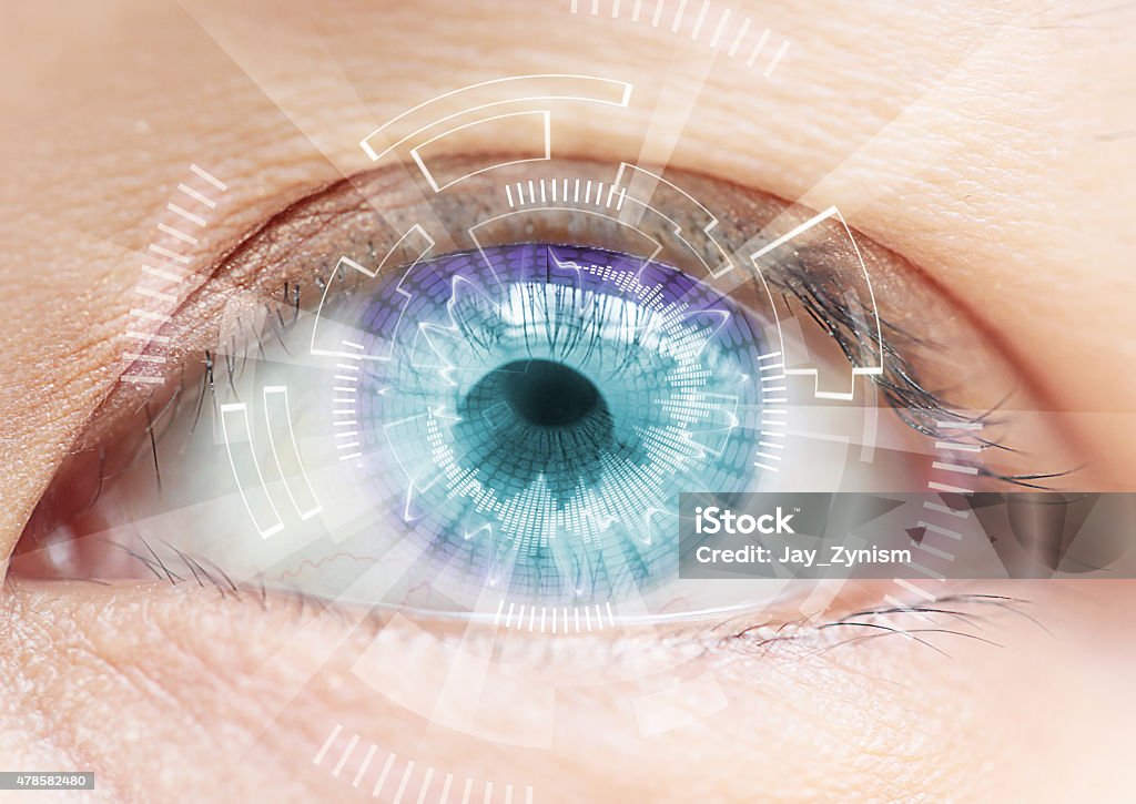 Close-up of woman's blue eye. High Technologies in the futuristi Close-up of woman's blue eye. High Technologies in the futuristic. : contact lens 2015 Stock Photo