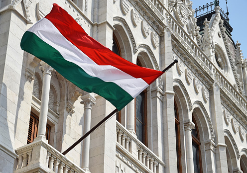 Hungarian flag in the window of the parliament building, Budapest, Hungary