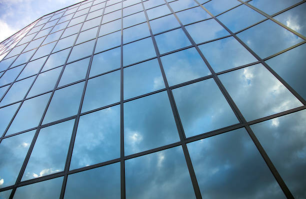 istock reflexions of clouds and  sky in modern building facade 478583329