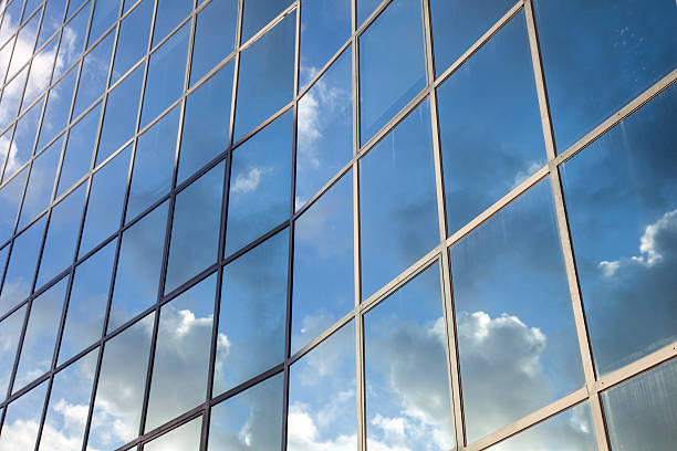 istock reflexions of clouds and  sky in modern building facade 478583343