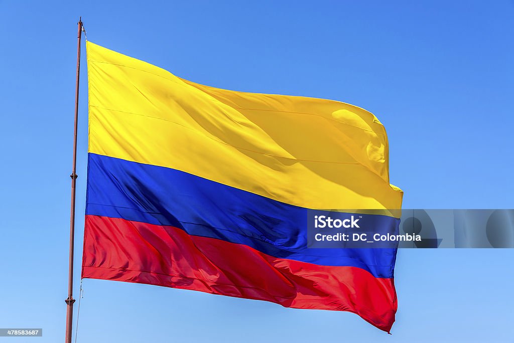 Colombian Flag Resplendent Colombian flag waving in the wind set against a beautiful blue sky Colombian Flag Stock Photo