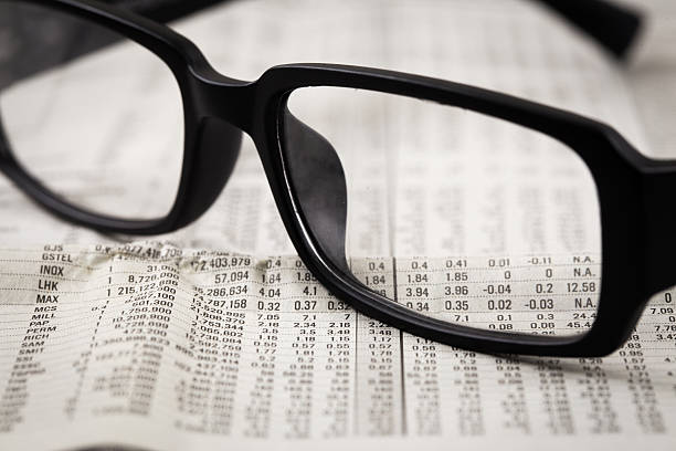 istock closeup glasses on financial newspaper 478583837