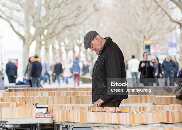 Man Browsing Second Hand Books Stock Photo - Download Image Now - Bookstore, London - England, Outdoors