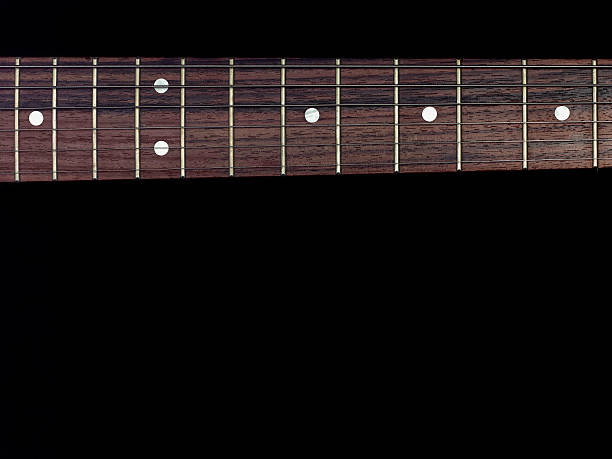 istock guitar fingerboard  isolated on black background 478586664