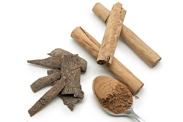 istock Cinnamon sticks and cinnamon powder isolated on white 478586802