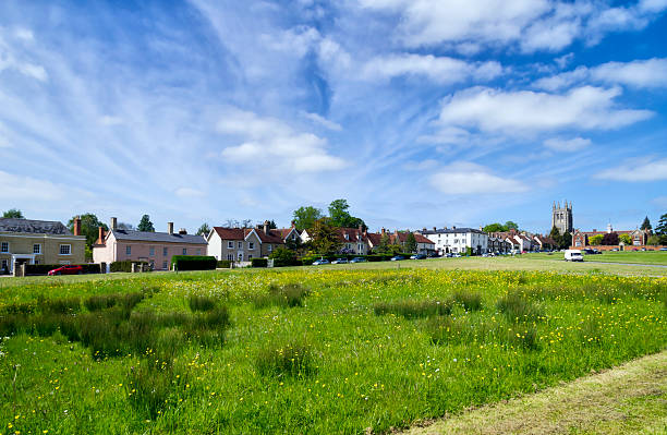 Color image depicting houses on residential streets on the edge green belt land in Guildford, Surrey, UK.
