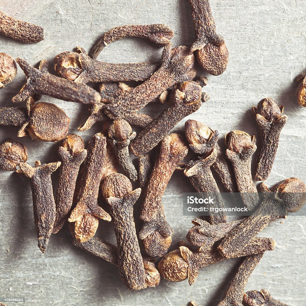 Cloves Close up of clove seeds on a stone surface Allspice Stock Photo