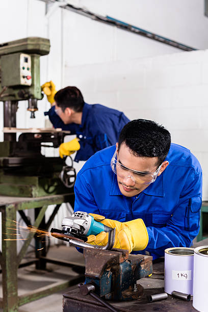 istock Metal workers in industrial workshop grinding 478590860