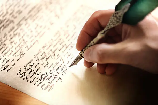 Photo of Writing with quill pen