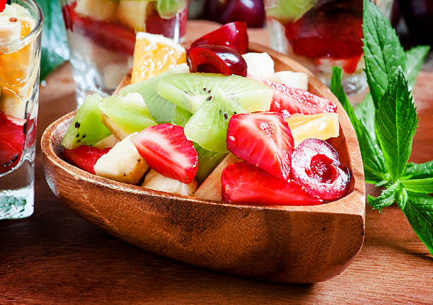 istock Dietary mixed fruit salad with fruit and berries 478590978