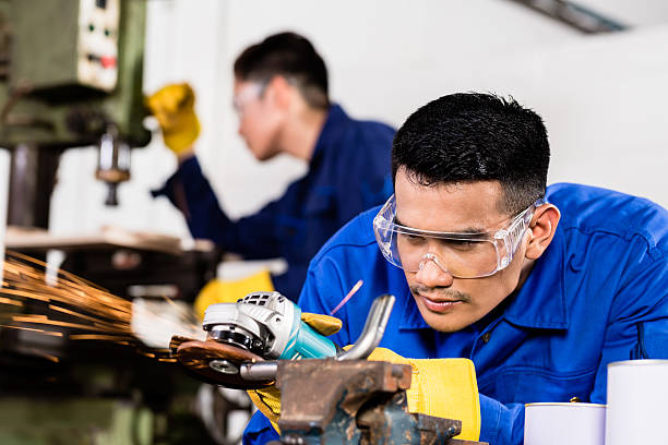 istock Metal workers in industrial workshop grinding 478590988