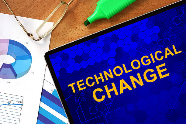istock Tablet with Technological Change  and charts on a wooden board. 478593470