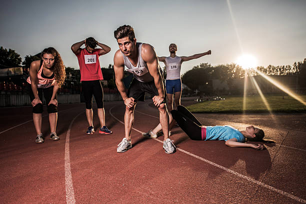 istock Exhausted group of young athletes finished their race. 478593804