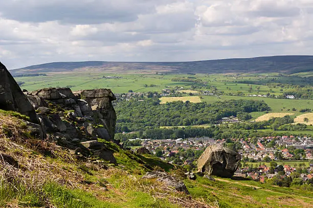 Ilkley town overlooked from Ilkley Moor (Cow and Calf Rocks). Near Leeds, Yorkshire, England