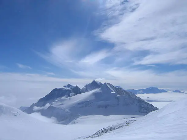 This photo was taken from below the summit of Antarctica's highest peak, Mount Vinson.  The Pyramid shaped mountain is Mount Shinn.  The Mountain Behind is Mount Tyree.