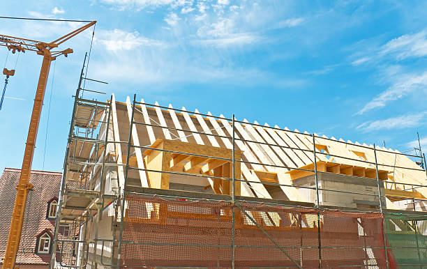 istock New building under construction with scaffolding and crane 478597982