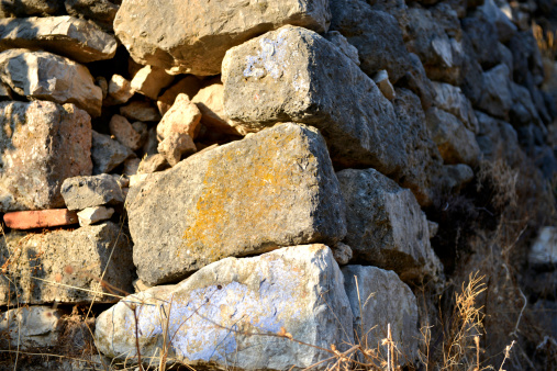 Large medieval stone wall. Flat focus, convenient for use as a background