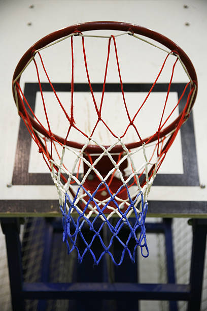istock Basketball hoop in a high school gym 478603776