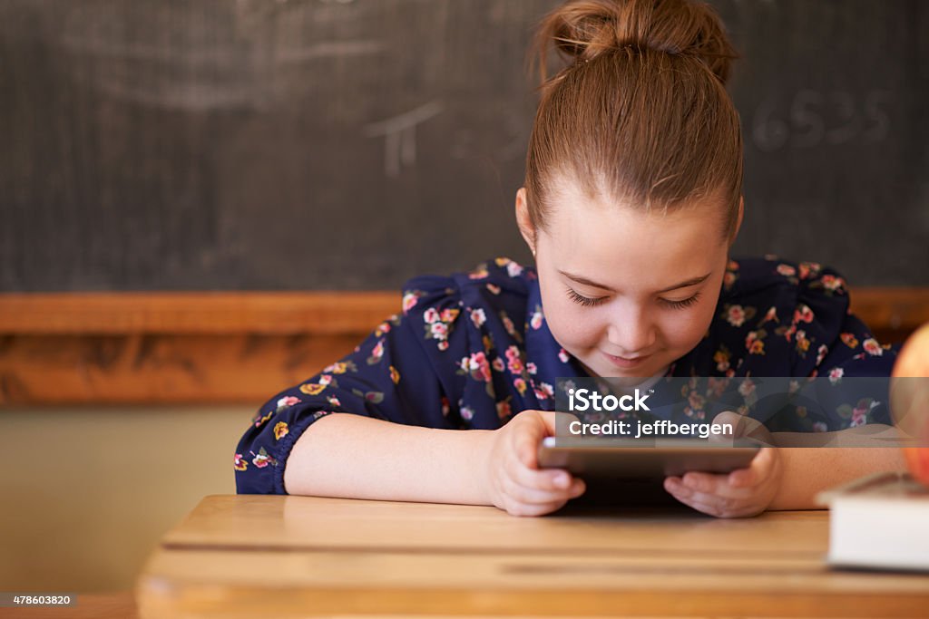 Learning just got easier with wireless technology Shot of little girl using a digital tablet at a deskhttp://195.154.178.81/DATA/i_collage/pu/shoots/805028.jpg 2015 Stock Photo