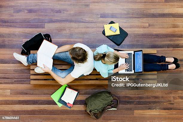 Top View Of Male And Female University Students Studying Stock Photo - Download Image Now