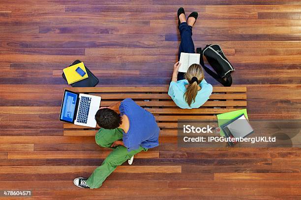 Top View Of Male And Female University Students Studying Stock Photo - Download Image Now