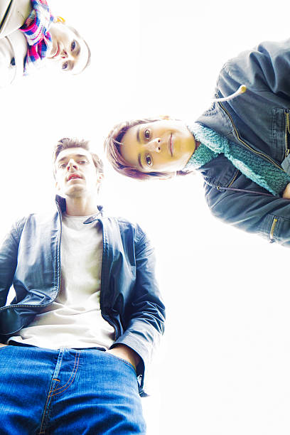 istock Three friends look down at camera reacting to accident 478608234