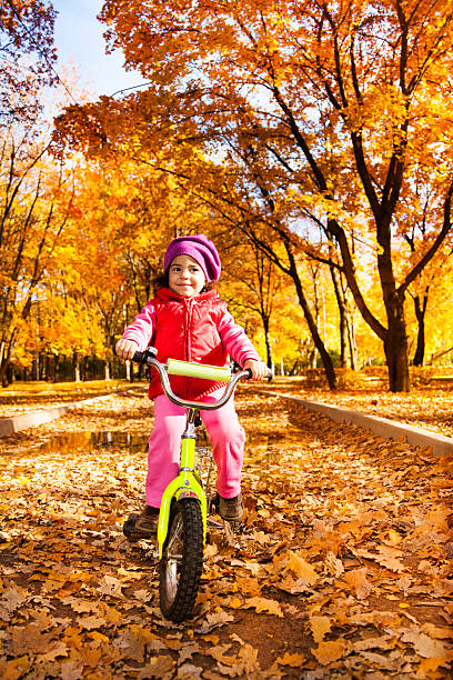 Little girl on a bicycle
