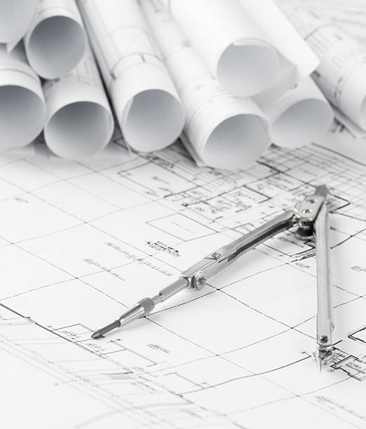 istock rolls of architecture blueprints and house plans 478609924