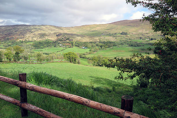 A view of fields and mountains in County Cork, Ireland.  County Cork, in southern Ireland, is home to Blarney Castle and the world famous Blarney Stone.