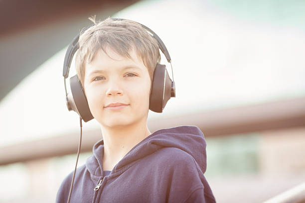 istock Young boy with headphones in vintage look 478623621