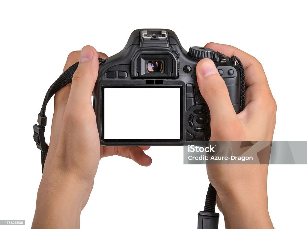DSLR camera in hand isolated Camera - Photographic Equipment Stock Photo
