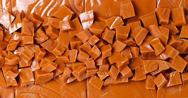 Photo of Background of brown toffee chunks