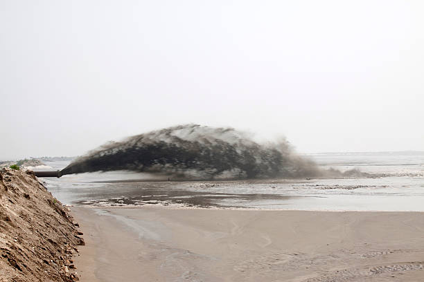istock blowing sand made land engineering by the sea 478625473