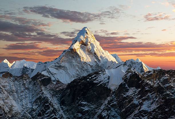 Evening view of Ama Dablam Evening view of Ama Dablam on the way to Everest Base Camp - Nepal mountain ridge stock pictures, royalty-free photos & images