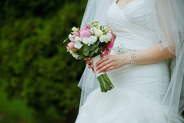 istock Beautiful wedding flowers in hands 478630446