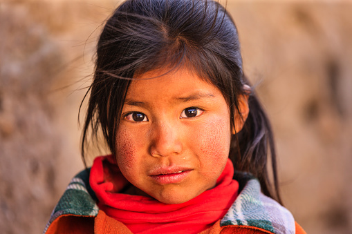 Little Peruvian girl near Canion Colca. Colca Canyon is a canyon of the Colca River in southern Peru. It is located about 100 miles (160 kilometers) northwest of Arequipa. It is more than twice as deep as the Grand Canyon in the United States at 4,160 m. However, the canyon's walls are not as vertical as those of the Grand Canyon. The Colca Valley is a colorful Andean valley with towns founded in Spanish Colonial times and formerly inhabited by the Collaguas and the Cabanas. The local people still maintain ancestral traditions and continue to cultivate the pre-Inca stepped terraces.http://bem.2be.pl/IS/peru_380.jpg