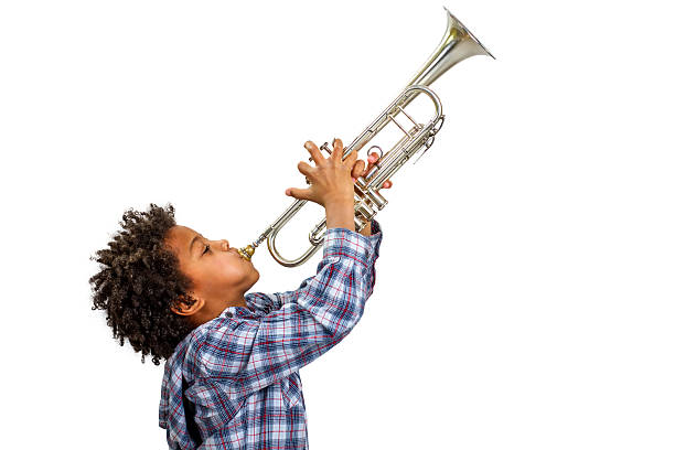 Trumpeter playing the blues. Young artist proudly plays the trumpet. Boy improvises on the trumpet. Trumpet playing the blues. juvenile musician stock pictures, royalty-free photos & images