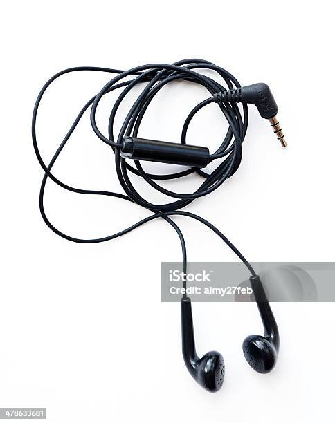 Black Earphones On A White Background Stock Photo - Download Image Now - Cable, In-ear Headphones, White Background