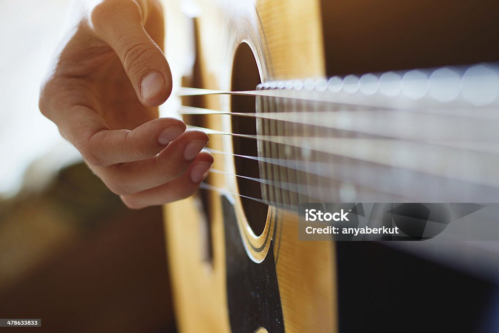 play acoustic guitar play acoustic guitar, close up of the hands Guitar Stock Photo