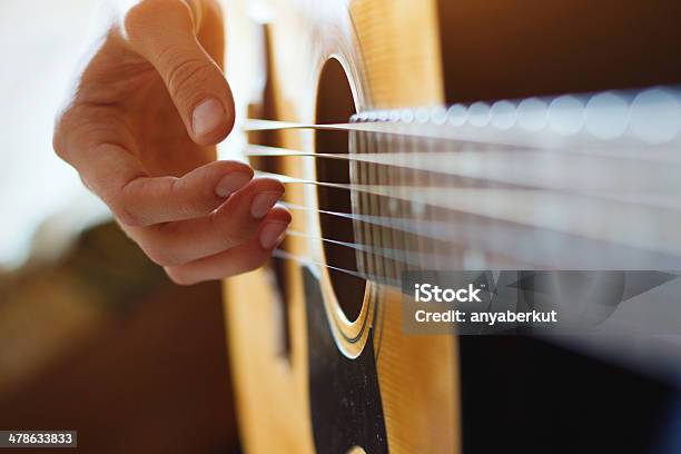 Play Acoustic Guitar Stock Photo - Download Image Now - Guitar, Plucking An Instrument, Acoustic Guitar