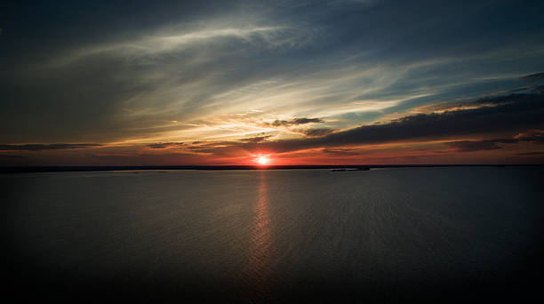 istock Drone flight over the water into the sunset 478634598