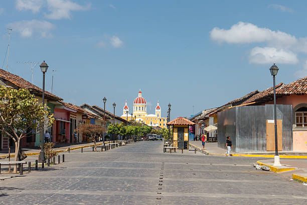 Leon, Nicaragua - March 30, 2018. Various traffic passes through a colorful intersection a block away from Iglesia el Calvario.