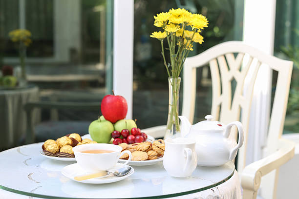 istock tea time with chocolate and cookies or biscuit and fruit 478634732