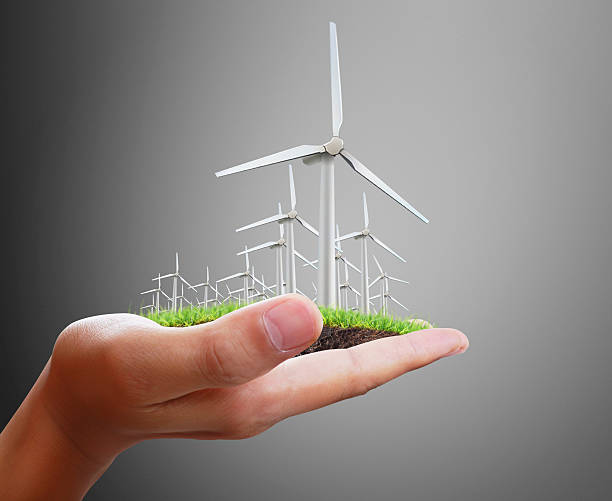 istock wind turbines in the hand 478635058